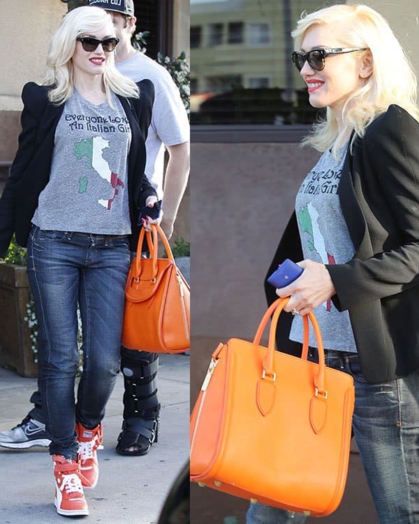 During her family outing, Gwen Stefani donned a pair of classic jeans, a comfortable gray t-shirt, and an impeccably tailored black blazer