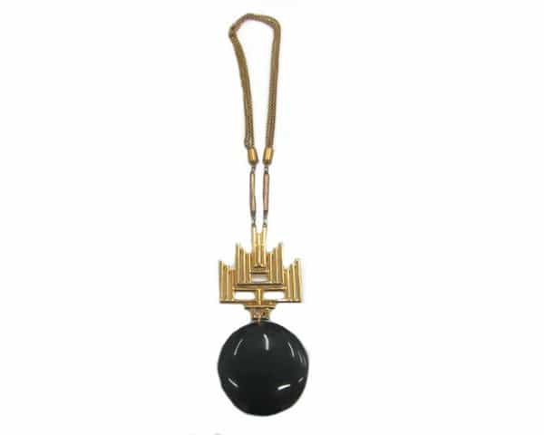 House of Lavande 1970s Castlecliff pendant necklace, valued at $848, featuring a black Bakelite pendant and intricate gold-tone details