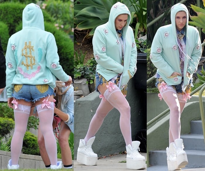 Pop star Ke$ha in high-top sneakers with white thigh-highs that connected with pink bow garters