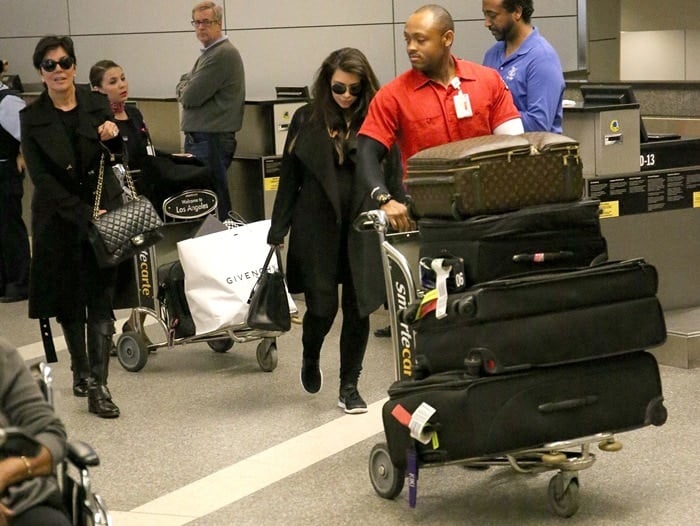 Kim Kardashian, with Kris Jenner, in Nike sneakers instead of her usual high heels at LAX on May 24, 2013