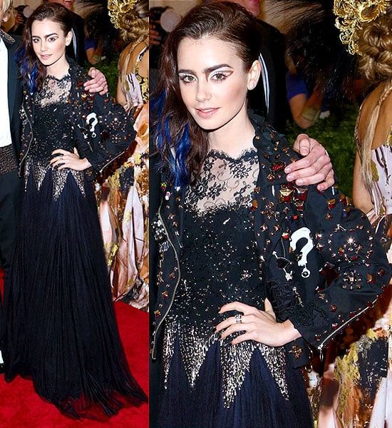 Lily Collins adds a touch of punk to her elegant gown with a studded Moschino jacket at the Met Gala 2013