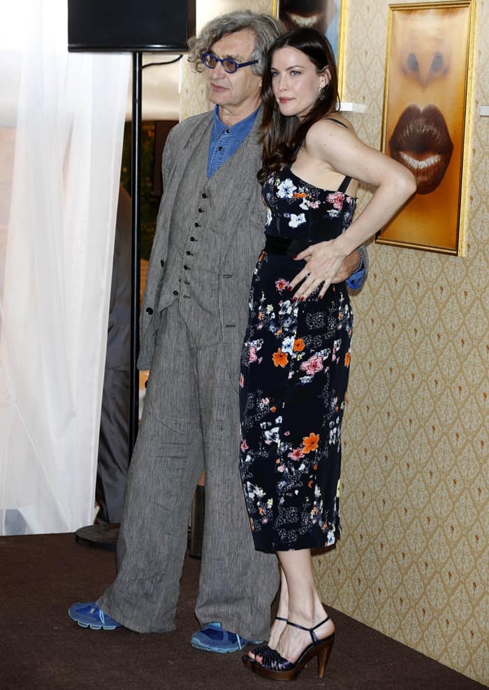 Liv Tyler and Wim Wenders posing at Magnum Ice-Cream's Beach during the 66th Cannes Film Festival