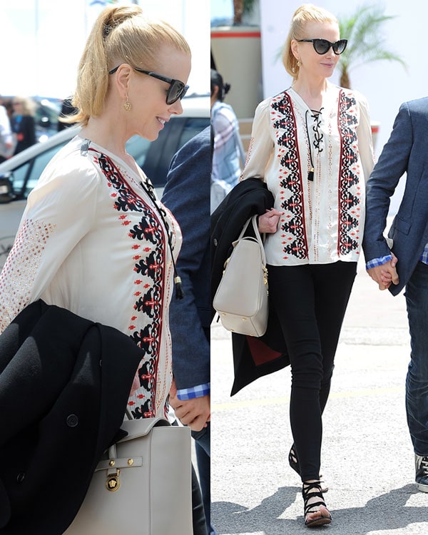 Nicole Kidman wearing an elegant embroidered top paired with black pants