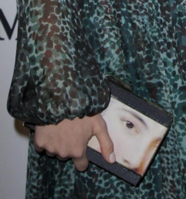 Olivia Wilde elegantly holds the Anya Hindmarch 'Duchess Lady' clutch at the Whitney Museum Annual Art Party, a unique accessory that adds a touch of art to her outfit
