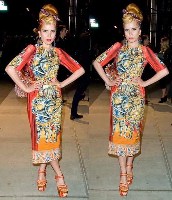 Paloma Faith captivates in Dolce & Gabbana’s Spring 2013 Ready-to-Wear Knights dress, an orange midi dress adorned with medieval imagery, at their Fifth Avenue opening