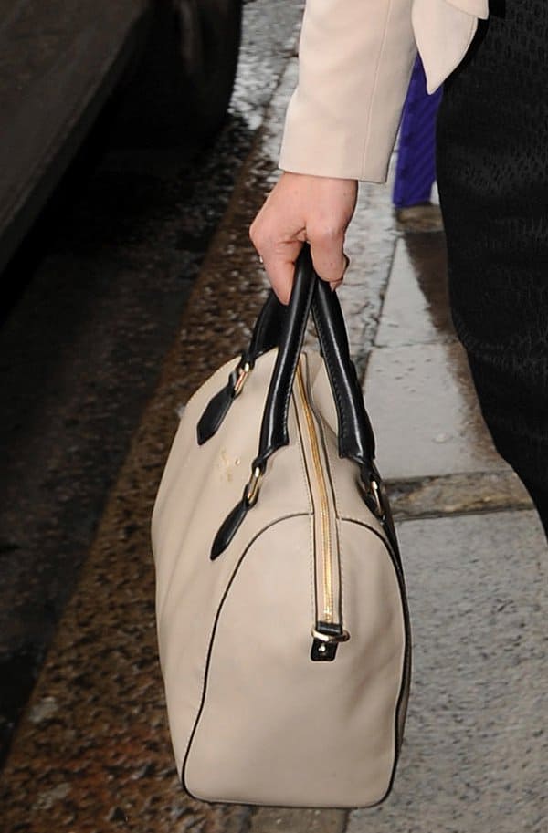 Pippa Middleton elegantly carrying a Kate Spade New York 'Catherine Street Pippa' satchel in dark chino color, as she exits a Vanity Fair event in London on May 14, 2013