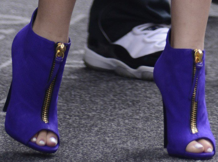 Zendaya's feet in purple zippered Giuseppe Zanotti peep-toes