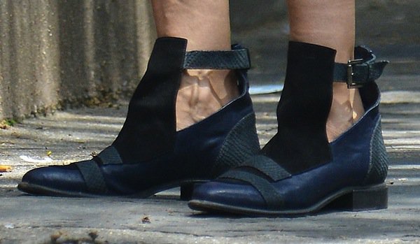 Detailed view of Sarah Jessica Parker's trendy cutout buckled booties, spotted in the West Village