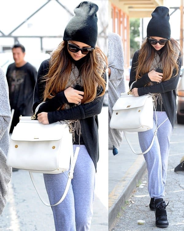 Selena Gomez rocks a Bdg Cooperative two-way scarf, sweatpants, Dolce & Gabbana Dg4149 sunglasses, and Top Moda Sammy 6 velcro high top sneakers