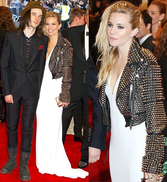 Joined on the red carpet by Tom Sturridge, Sienna Miller channels punk elegance in a studded Burberry leather jacket at the Met Gala 2013, complete with a spiky headband