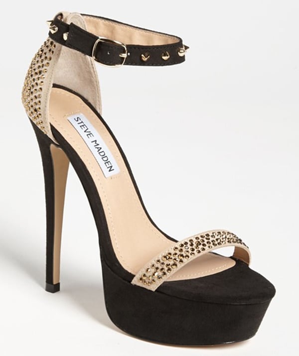 Glittery crystals light up a sultry two-tone pump with pointy metal spikes on the slender ankle strap