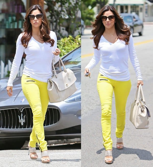 Eva Longoria showcases her chic look in yellow skinny jeans paired with a white long-sleeved top and silver-detailed Coach Steffi heels, as she steps out from Ken Paves hair salon in Los Angeles on May 22, 2013
