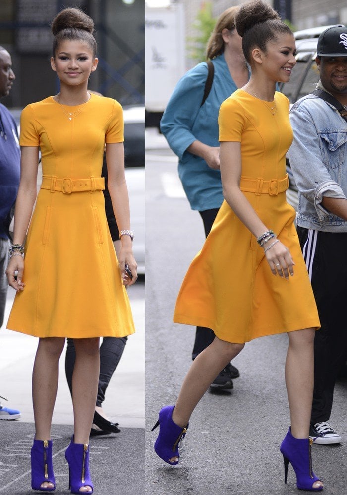 Zendaya wears a marigold-hued belted dress while out in Manhattan