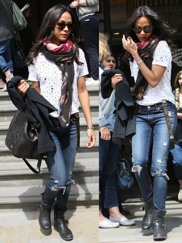 Zoe Saldaña pairs her dark-washed denim jeans with chic black ankle boots in a casual yet trendy look