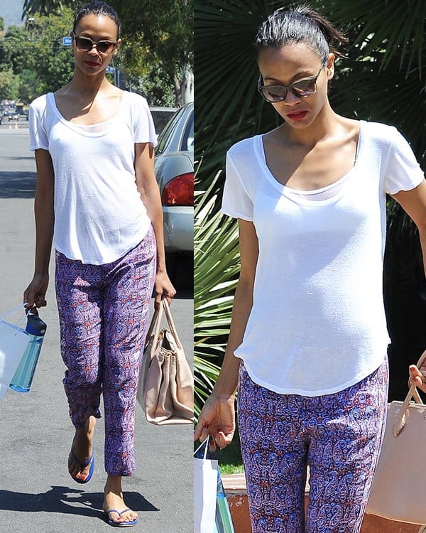Actress Zoe Saldaña departs from a private residence in West Hollywood, elegantly casual in Ella Moss 'Dixon' paisley pants, paired with a simple white tee and flip-flops, on May 11, 2013