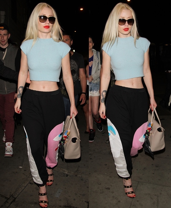 Iggy Azalea wearing a hot pair of Versace heels with graphic sweatpants and an aquamarine crop top