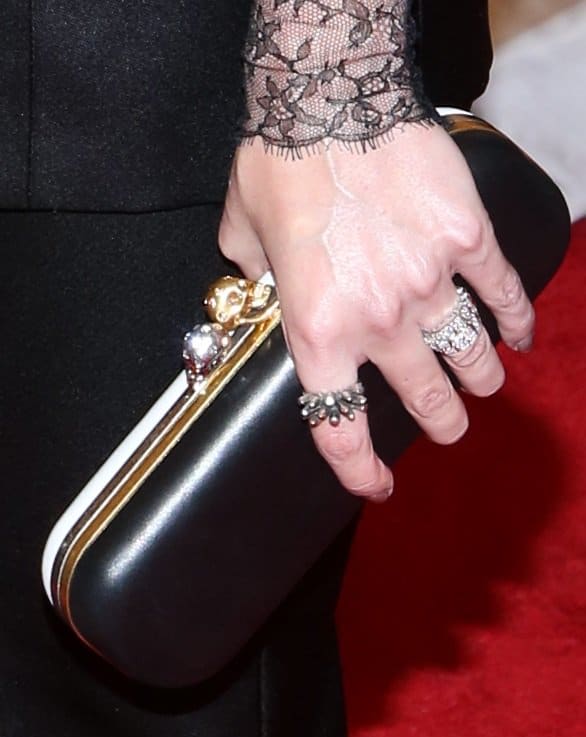 Jaime King's look was completed with a striking Alexander McQueen black-and-white clutch, featuring a unique design that added an extra layer of sophistication to her ensemble