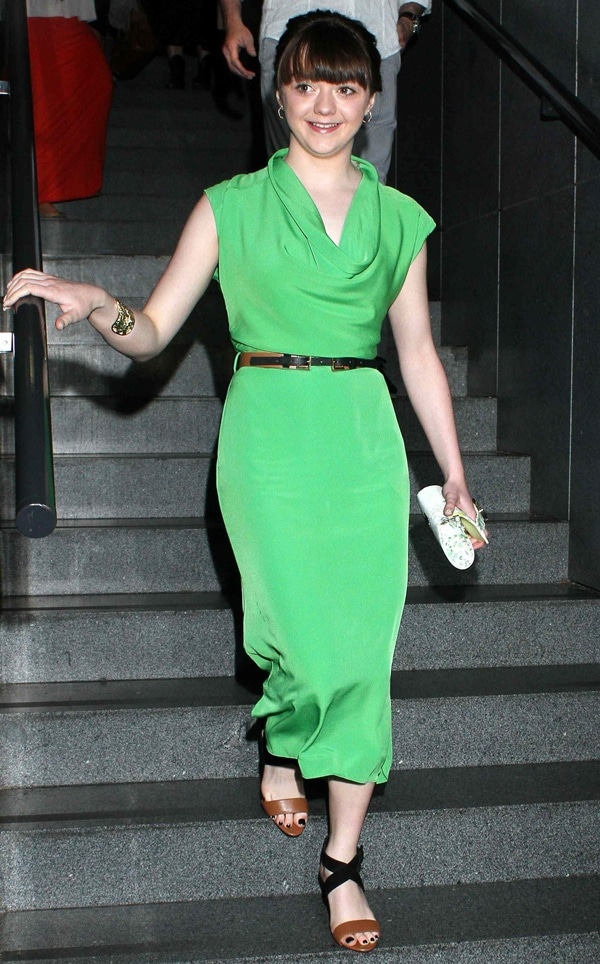 Maisie Williams wearing a green cowl neck dress