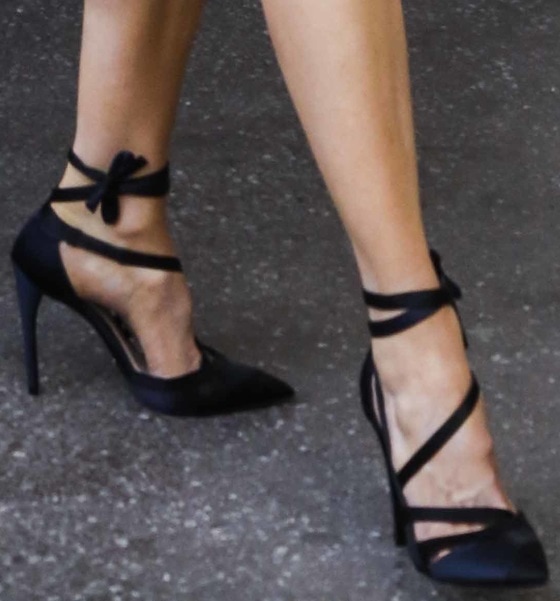 Nicole Kidman’s black pointed-toe ankle-tie heels add height and elegance, perfectly elongating her legs with their sleek design