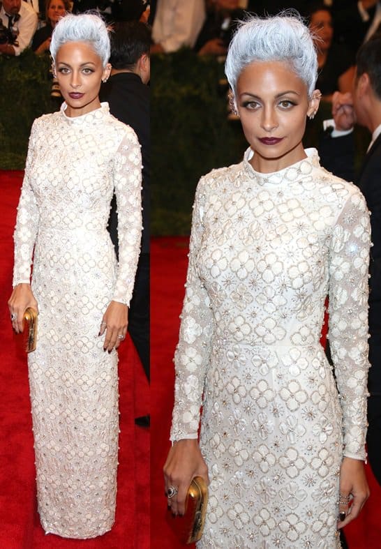 Nicole Richie brought a distinctive style to the Met Gala with her all-white ensemble, featuring a sleek, cutout gown from Topshop