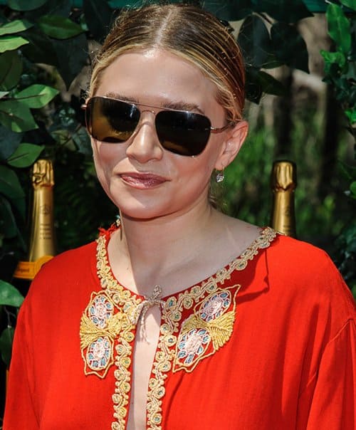 Ashley Olsen wearing a red kaftan that was two sizes too big for her