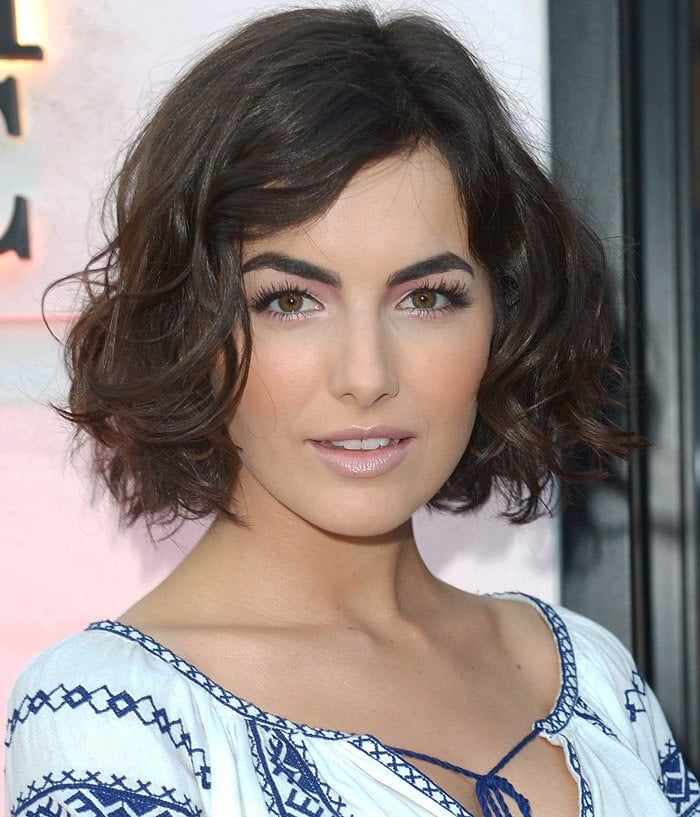 Camilla Belle captivates with her striking gaze and flawless makeup at the Carolina Herrera boutique launch in Beverly Hills, sporting a chic patterned dress, June 26, 2013