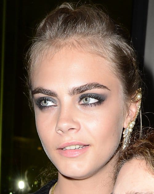 Elegance meets edge: A detailed view of Cara Delevingne's exquisite Ryan Storer ear cuff