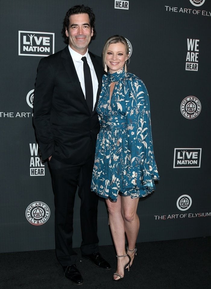 Carter Oosterhouse and his wife Amy Smart attend The Art Of Elysium Presents WE ARE HEAR'S HEAVEN 2020 at Hollywood Palladium