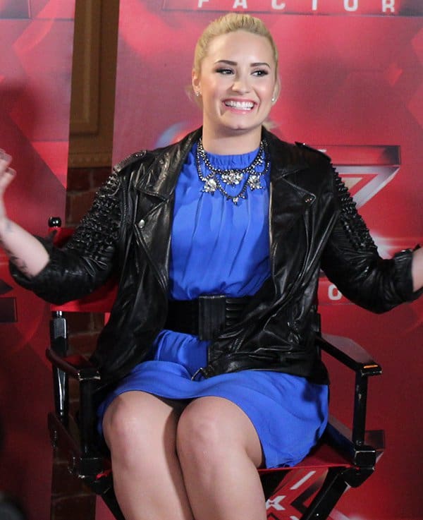 At the Long Island X-Factor auditions, Demi Lovato sported a Christopher Kane gathered mini dress, complemented by a 3.1 Phillip Lim biker jacket and a bib necklace