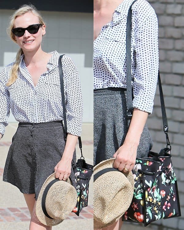 Diane Kruger wearing a star-printed Equipment signature top that she paired with a gray skater mini skirt