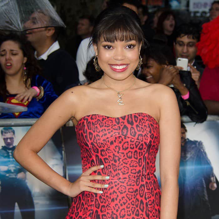 Dionne Bromfield in a red leopard-print dress