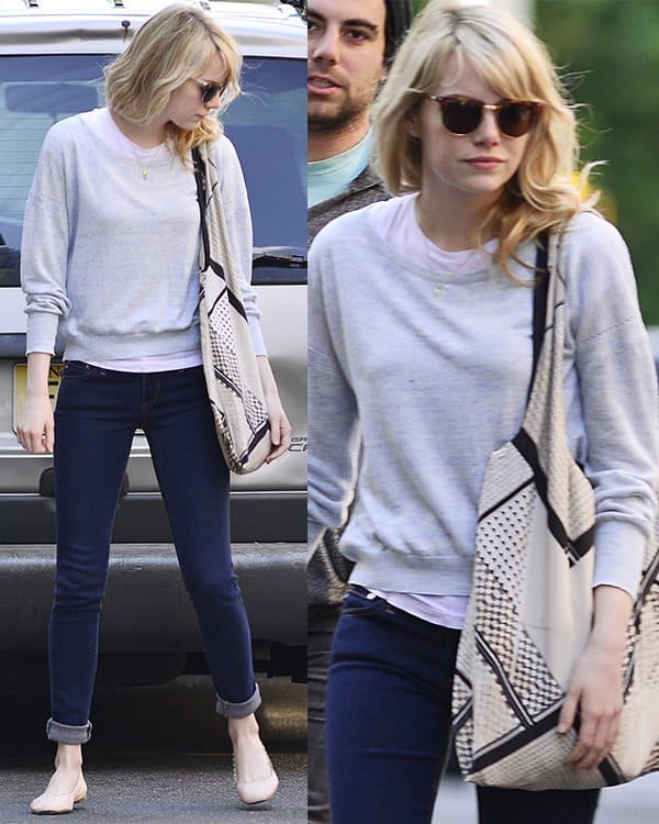 On June 19, 2013, in New York, Emma Stone styled a casual chic look featuring AG Adriano Goldschmied legging jeans, Chloe Lauren scalloped ballet flats, Rag & Bone Monroe sunglasses in matte tortoise, and a Twelfth St. by Cynthia Vincent silk printed tote bag