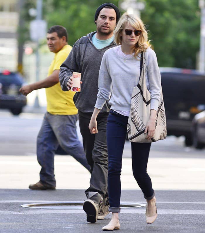 Emma Stone sports Chloe scalloped patent leather ballerina flats, showcasing her relaxed off-duty style