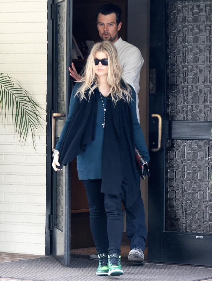 Fergie conceals her pregnancy with a stylish black neck warmer while leaving church with Josh Duhamel
