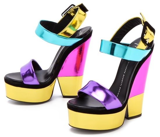Flashing metallic leather brings cool glamour to these colorblock Giuseppe Zanotti sandals, designed with a shimmering platform and sculpted heel for dramatic height