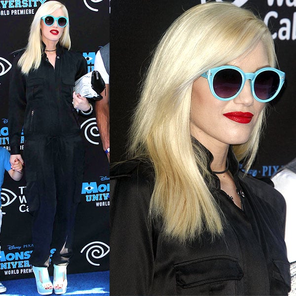 Gwen Stefani stuns in a chic black jumpsuit paired with aqua-blue sunglasses and platform heels—replicate her look with bold accessories and a sleek monochrome outfit for instant glam
