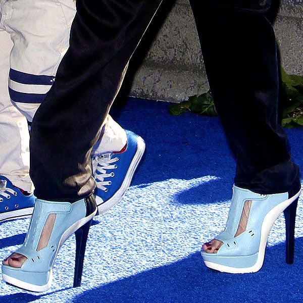 Gwen Stefani's baby blue open-toe sandal booties steal the spotlight with their bold cutout design, sleek stiletto heel, and sky-high platform