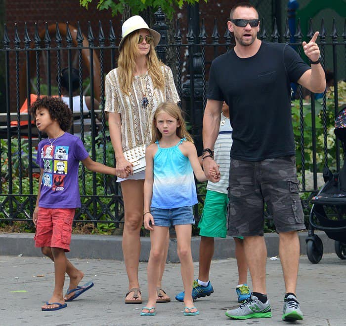 Heidi Klum, alongside Martin Kristen and her children, enjoys a family outing in the West Village, showcasing casual style