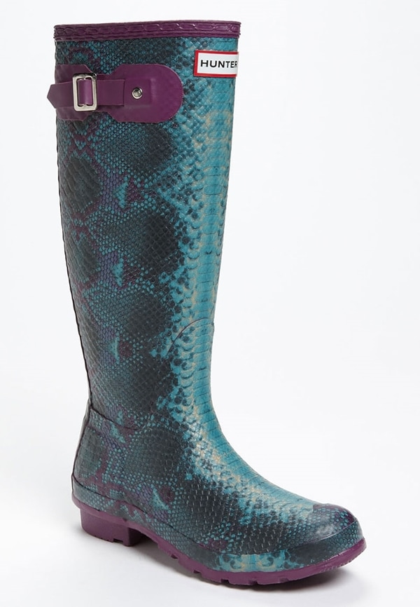 These Hunter Carnaby rain boots exude edginess with their turquoise color, serpentine texture, and striking purple trim