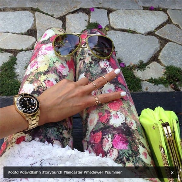 Close-up of Jamie Chung's David Kahn "Nikki" ankle jeans featuring a dark, moody floral print