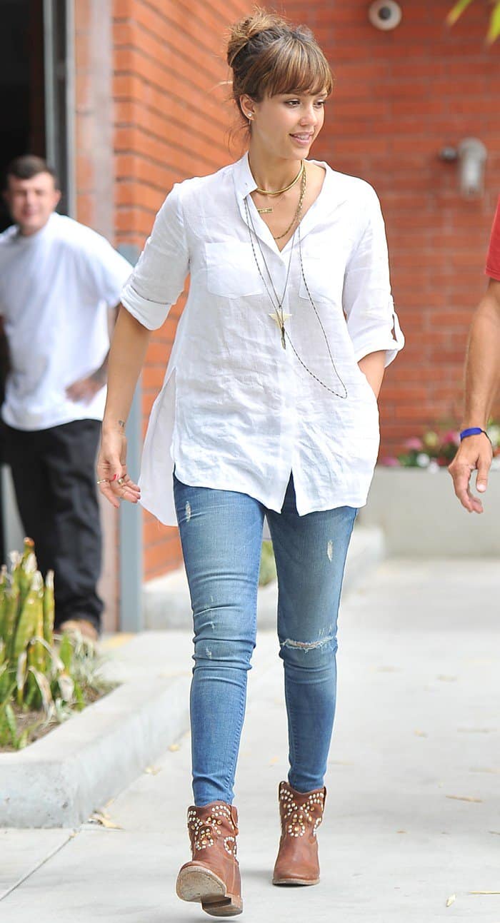 Jessica Alba was spotted at lunch in Beverly Hills wearing Black Orchid mid-rise jeggings in Splash, Isabel Marant's Caleen studded leather concealed wedge boots, and a Frasier Sterling Mystic labradorite skinny necklace with a Buddha charm