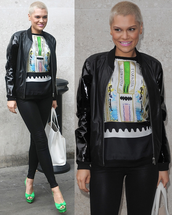 Jessie J exudes rock-star vibes as she approaches BBC Radio 1 Studios, showcasing her unique style in leather pants and a bomber jacket with patent leather sleeves, all paired with a sleeveless graphic tee