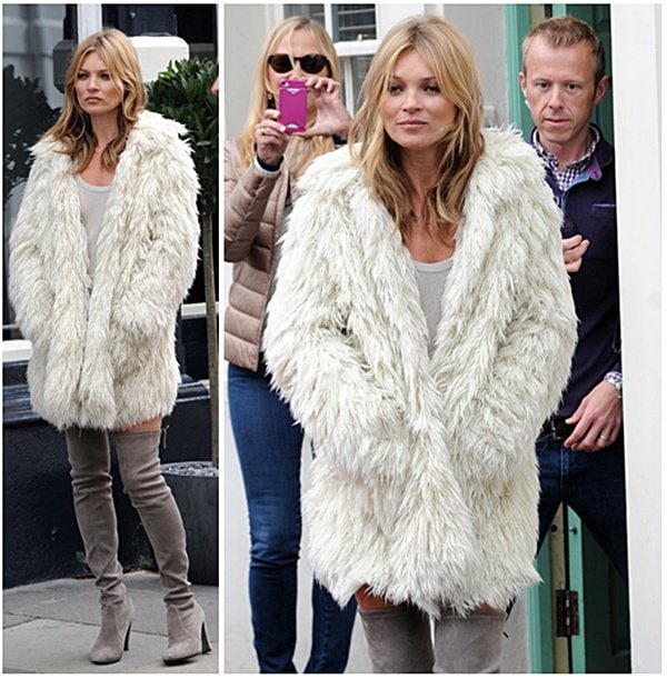 Kate Moss sporting a white faux fur jacket as she walked and posed for the cameras in the busy streets of London