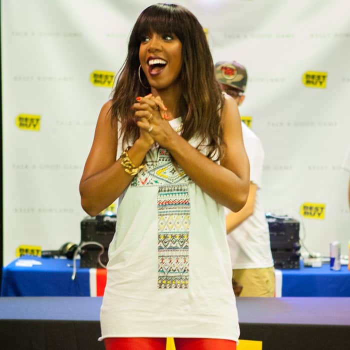 Close-up of Kelly Rowland's edgy street-rock style, highlighted by an embroidered white cross tank top