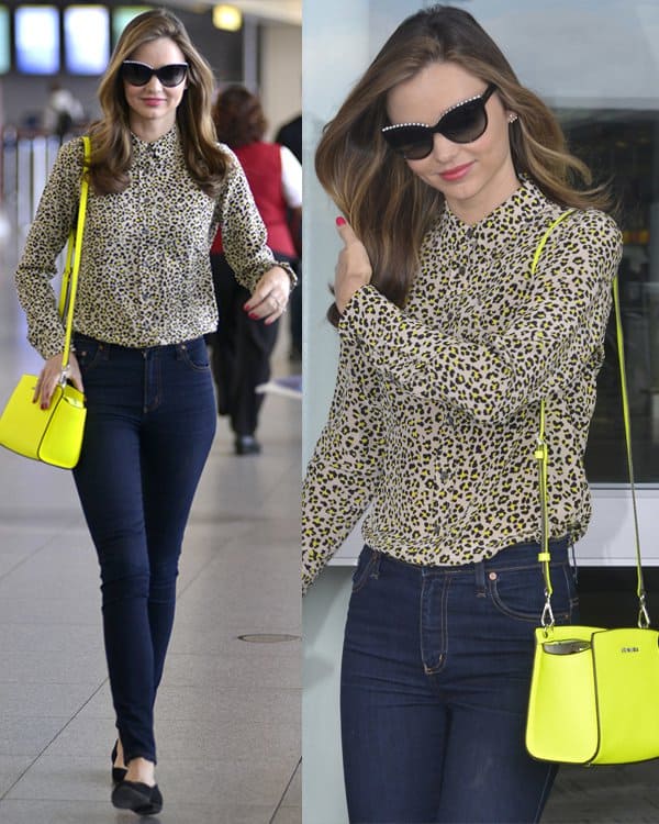 Miranda Kerr was spotted at JFK Airport in NYC on June 14, 2013, sporting a chic ensemble that included Givenchy zipper ballet flats, Nobody Cult skinny jeans in Addict, Chanel 6040 pearl sunglasses, a Michael Kors Selma messenger bag in neon yellow, and an Equipment Brett leopard-print washed-silk shirt