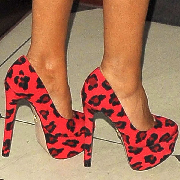 Preeya Kalidas shows off her feet in red leopard-print platform pumps