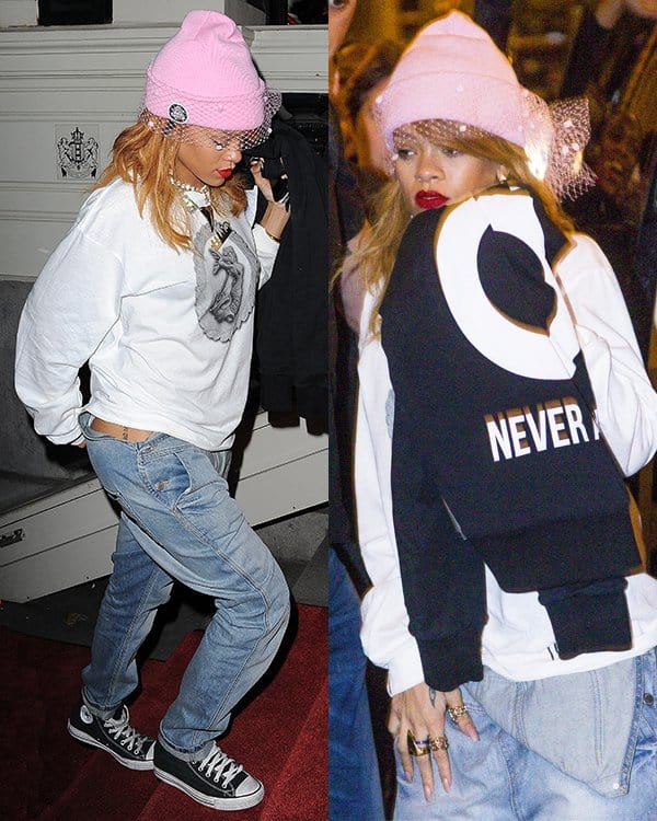 Rihanna sported overalls worn half-down like a pair of jeans paired with an oversized sweater