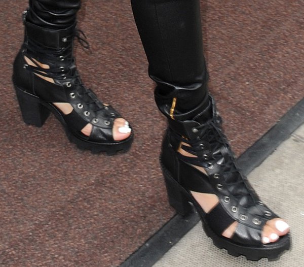 Rihanna styled her ankle boots with leather leggings