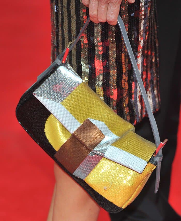 Close-up of Sarah Jessica Parker's eclectic Fendi 'Baguette' bag, showcasing its unique patchwork design