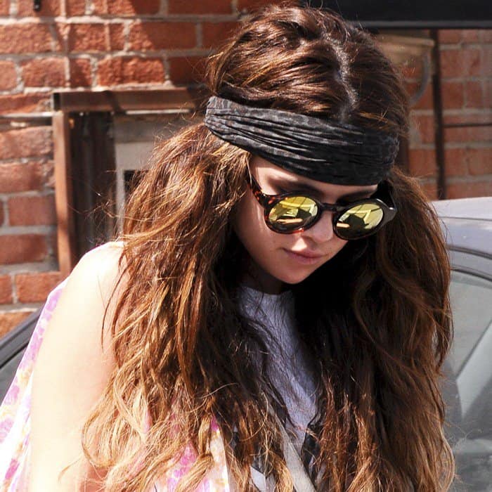 Selena Gomez was spotted sporting a Free People printed headband in black cheetah and Free People Pladium sunglasses in tortoise